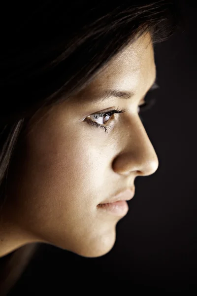 Face Side View of Teenage Female Girl on Black
