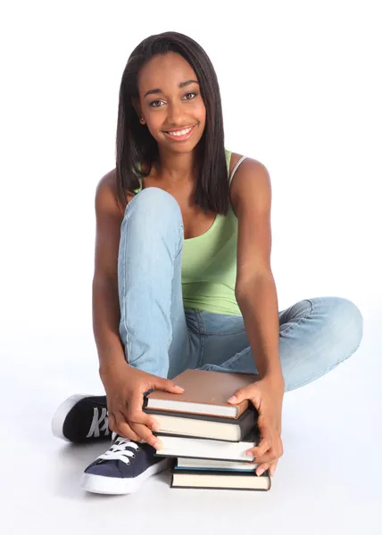 Beautiful black teenage girl with school books