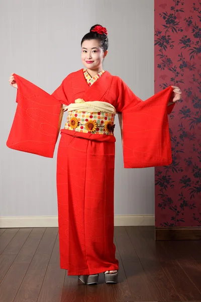 Oriental model shows sleeves on Japanese kimono