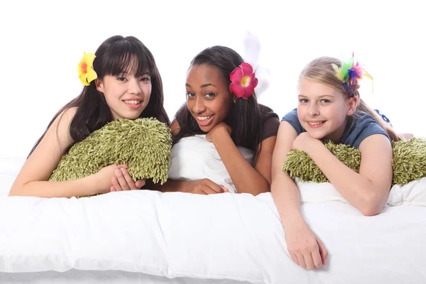 Teenage girls slumber party with hair accessories