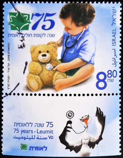 Stamp making health care a child with his teddy bear