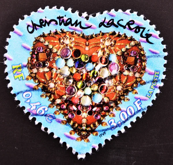 Stamp shows heart of Christian Lacroix with jewelry inside