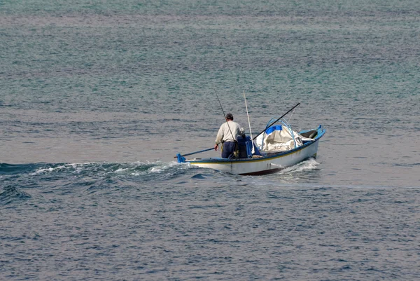 Fisherman in a small boat.