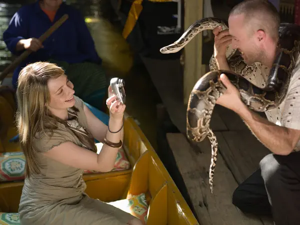 Man Holding Snake