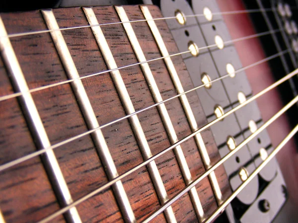 Close up electric guitar frets