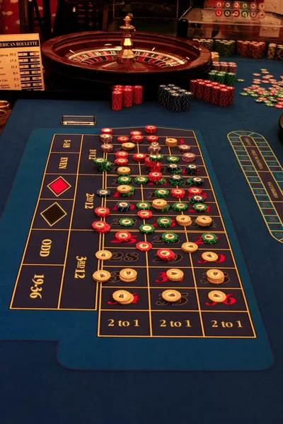 Roulette table in casino with chips