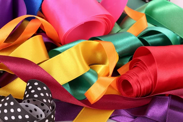 Many beautiful bright satin ribbons