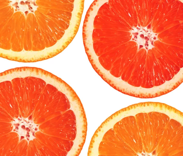 Orange and grapefruit slices closeup isolated on white backgroun