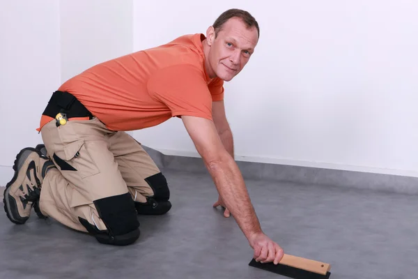 Man fitting new flooring