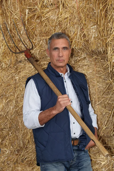 farmer holding pitchfork