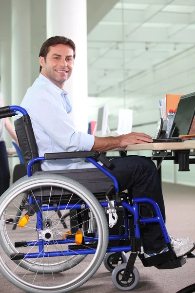Disabled office worker using a laptop