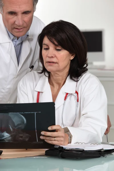 Doctors examining x-ray