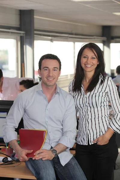 Nice man and woman working in an office — Stock Photo #7904802