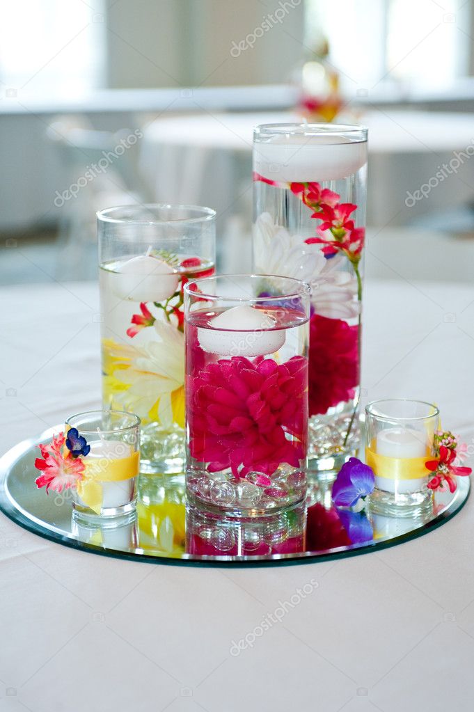 wedding centerpiece with floating candles and flowers