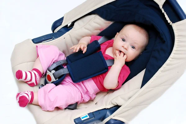 Baby in car seat over white