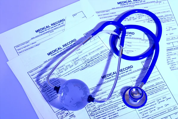 A prescription form and stethoscope on a doctor\'s desk
