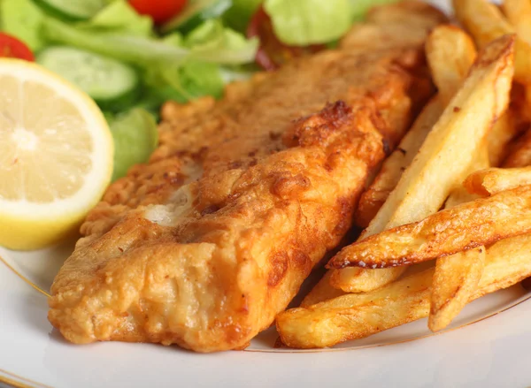 Battered fish with chips and salad