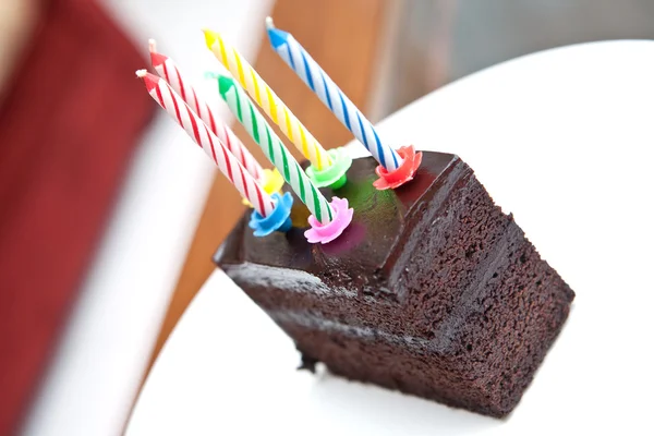 Delicious chocolate fudge cake with candles