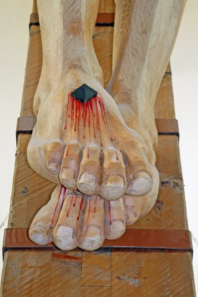 Nailed and bleeding feet of Jesus