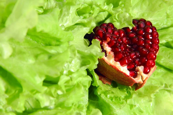 Pomegranate heart on lettuce
