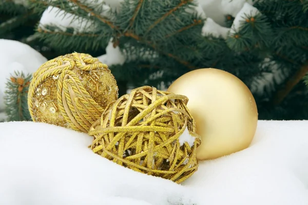 Gold ornaments on snow