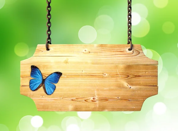 Wooden sign with a butterfly