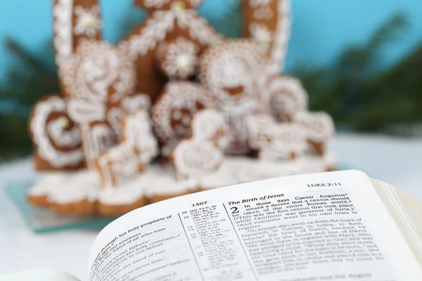 Bible and gingerbread nativity scene