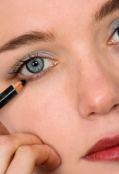Applying eye liner - makeup series
