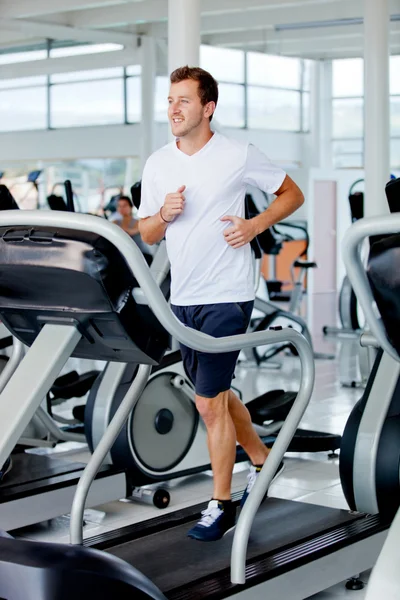 Man running at the gym