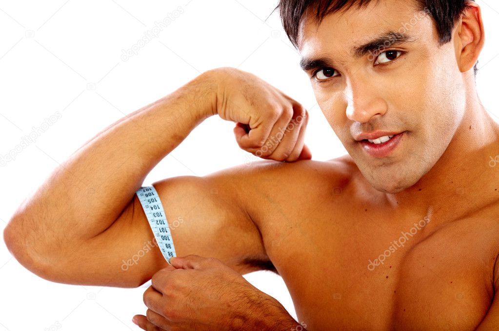 Strong man measuring his bicep muscle isolated over a black background — Photo by andresr - depositphotos_7767872-Strong-man-measuring-his-biceps