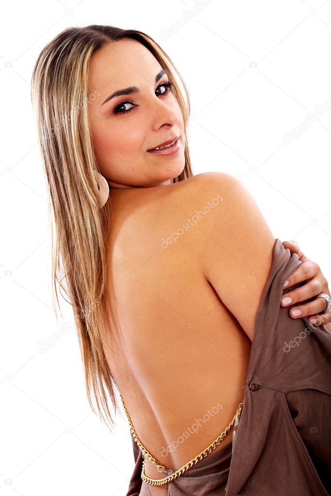 Beautiful fashion girl wearing a brown dress and smiling bare back 