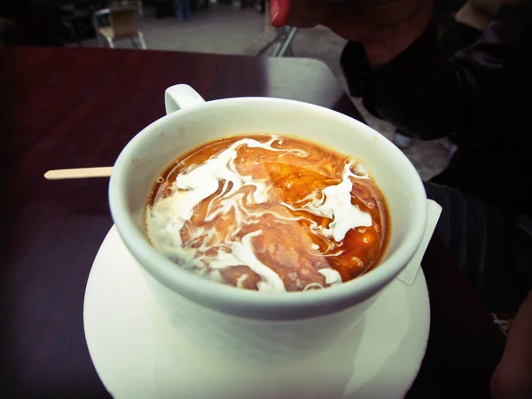 Coffee with milk swirls