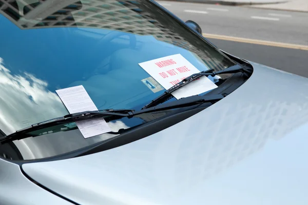 Parking Ticket Under Windshield Wiper On Car, Warning Sign