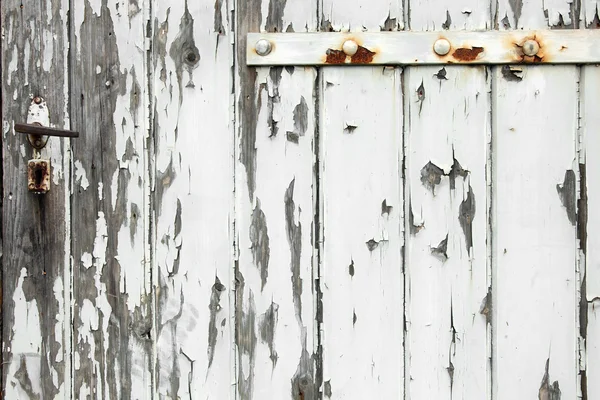 Old wooden door with peeling paint