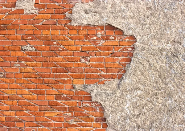 Wall for background texture with damaged plaster and bricks