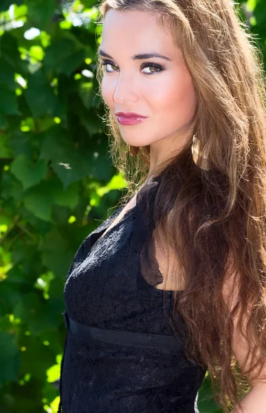 Beautiful girl in a dress black — Stock Photo, Image