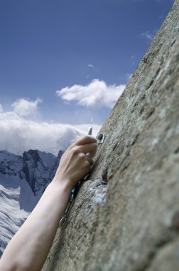 Climber's hand with quick-draws clipart