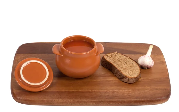 Borsch with bread and garlic on wooden kitchen board — Stock Photo, Image