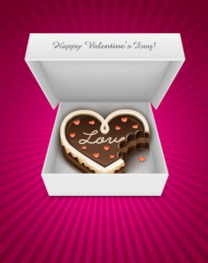Open box with nibbled chocolate cake in heart form clipart