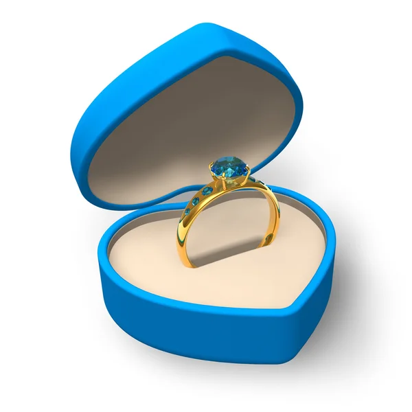 Caja azul en forma de corazón con anillo de oro con joyas — Foto de Stock
