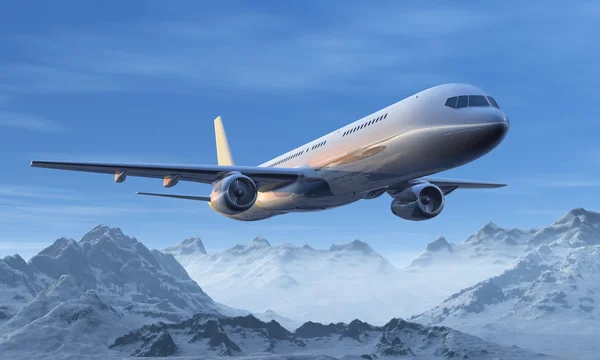 Morning airliner flight over the snowy mountain peaks — Zdjęcie stockowe