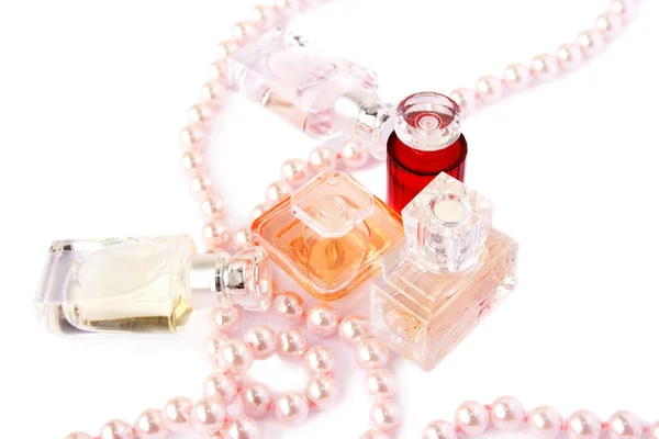 Perfume bottles and necklace — Stock Photo, Image