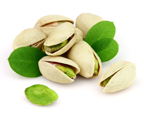 Pistachio nuts with leaves — Stock Photo, Image