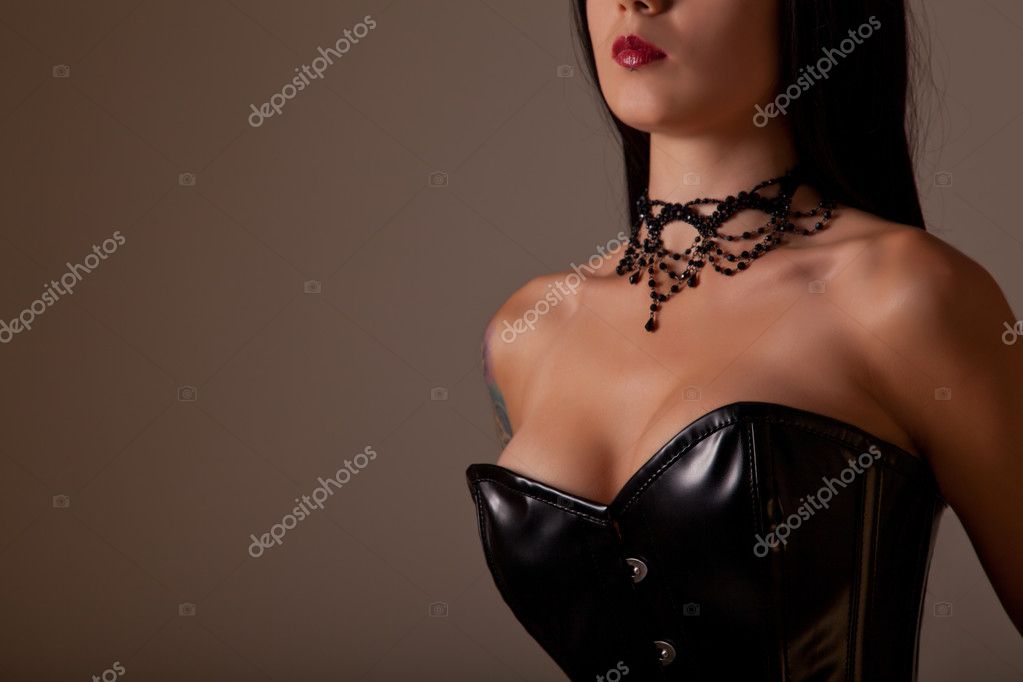 Close-up shot of a busty woman in elegant corset Stock Photo