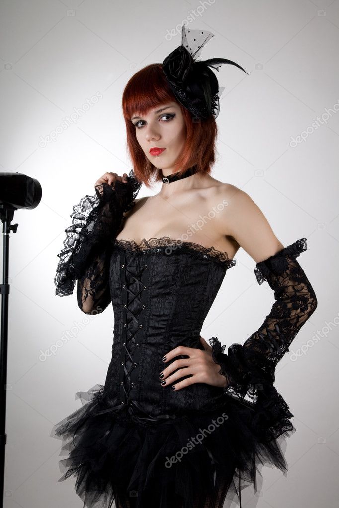 Attractive woman in black corset and tutu skirt
