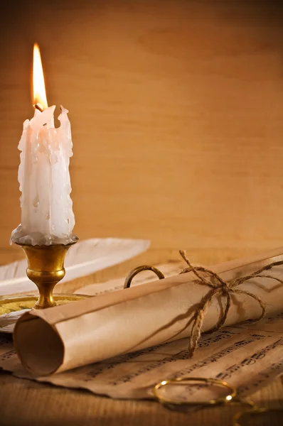 Roll of old paper andle candle — Stock Photo, Image