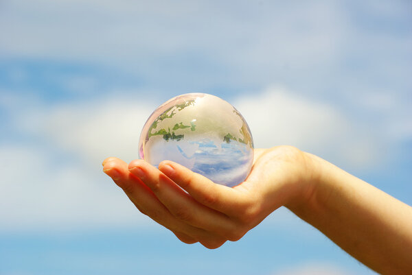 Globe in hand