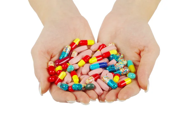 Mãos segura pílulas — Fotografia de Stock