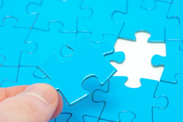 Hands holding a puzzle — Stock Photo, Image