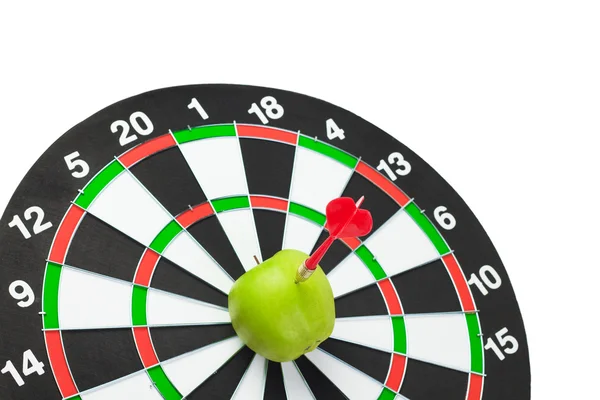 Dart hit green apple in the centre of target — Stock Photo, Image
